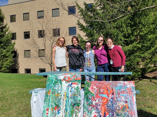 lab members with their new artwork