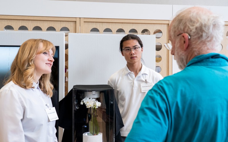 Two students present their design project